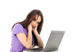Stressed woman with laptop