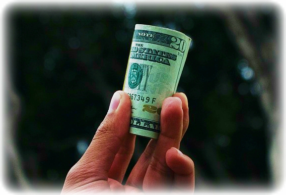 Hand holding money